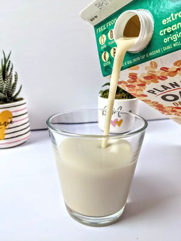 Planet Oat Oatmilk pour into glass