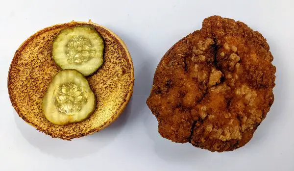 Mcdonald's crispy chicken sandwich top off separated from patty