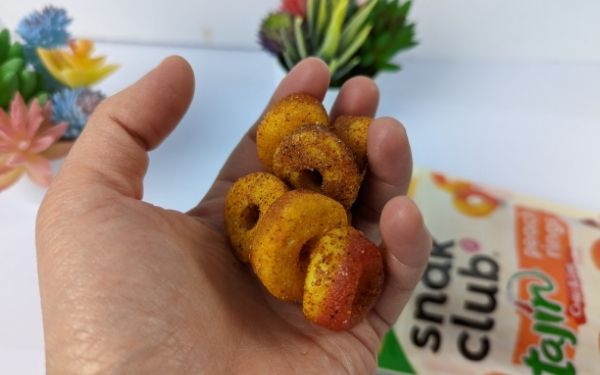 (On hand close up) Snak Club Tajin Peach Rings - BanhMiFresh.com