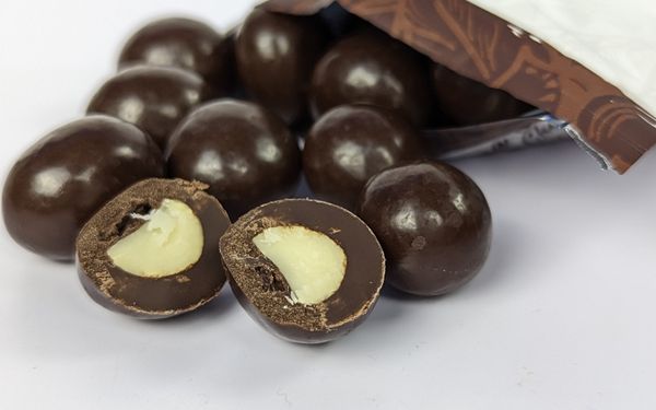 Macfarms kona coffee dark chocolate macadamias cross section view - familyguidecentral.com
