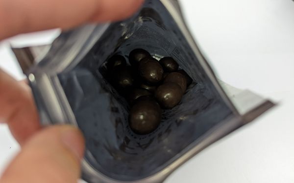 Macfarms kona coffee dark chocolate macadamias inside the bag - familyguidecentral.com