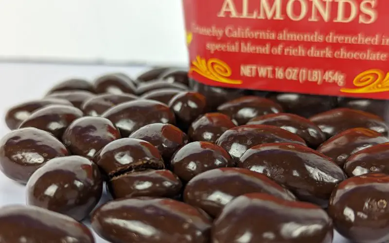 Trader joes dark chocolate covered almonds close view pour out - banhmifresh.com