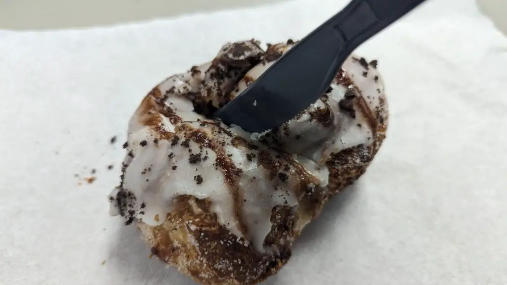 Parlor Doughnuts cookie and cream knife cutting into it - banhmifresh.com